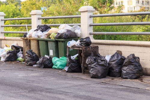 Workers sorting recyclable materials at a local depot